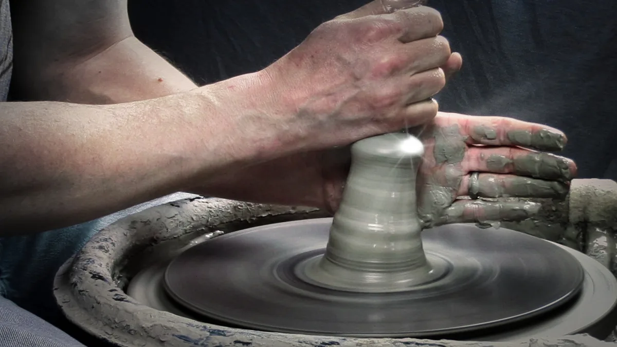 move the clay as it spins